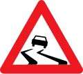 A31: Glat vej - gul trekant med bil der skrider